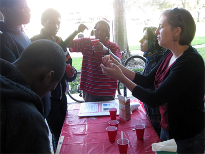 Dr. Conrad and her
		     student Firoozeh play with oobleck at the Mars
		     Rover event in January 2012