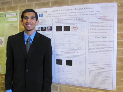 Tahir presents his
		     poster on nanoparticle dynamics in polymer matrices.